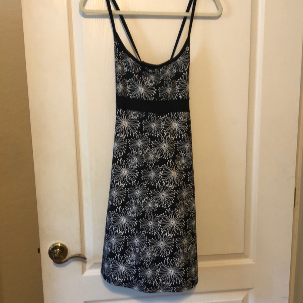 Cute Black and white sundress with a crisscross straps in the back.
